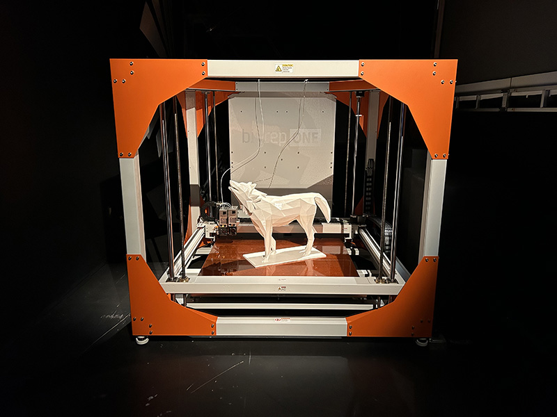 A 3D printed lobo sits inside the printer at ARTSLab facilities